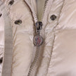 Piumino Moncler beige lungo Hirma con cappuccio