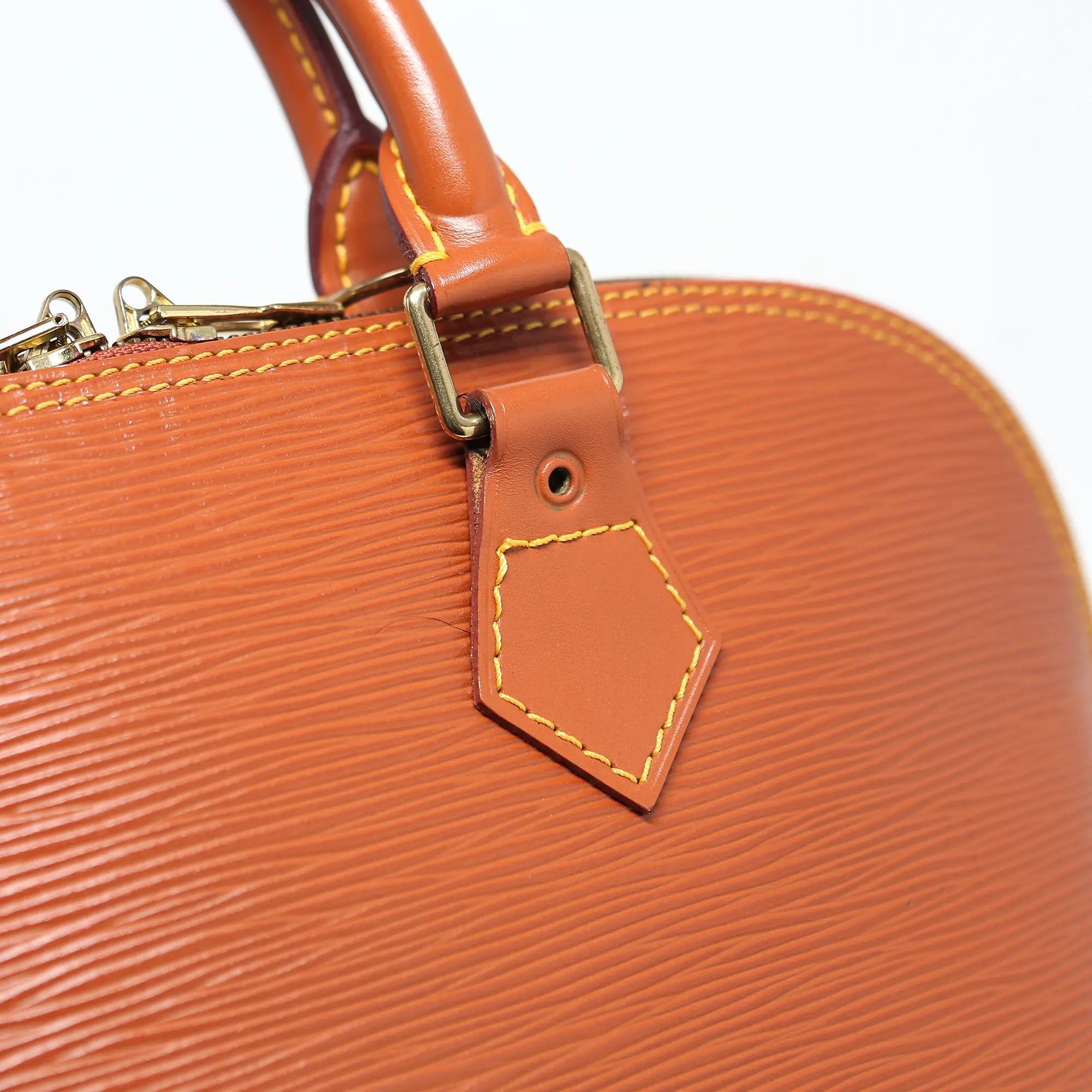 Borsa a mano Louis Vuitton Alma pelle EPI cognac