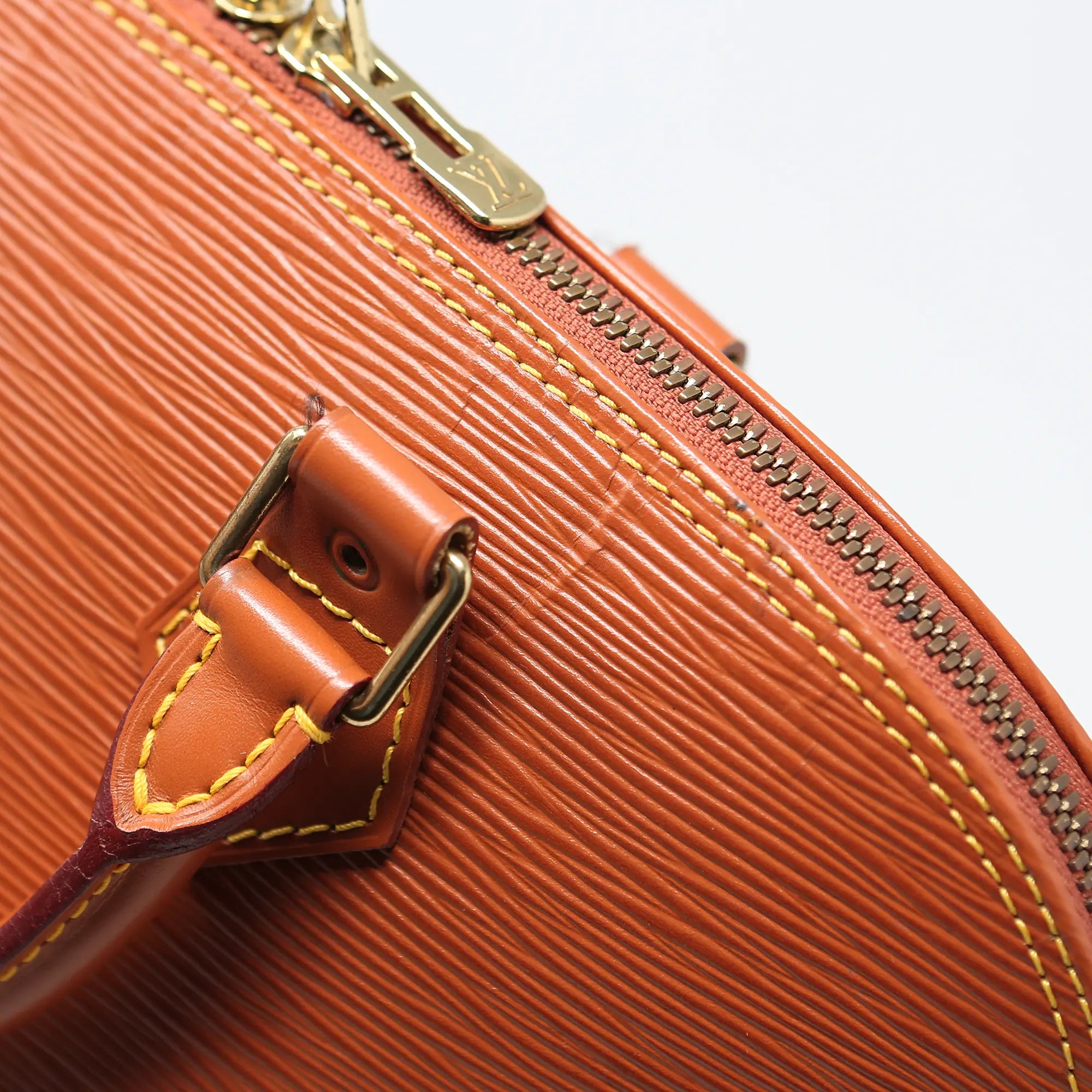 Borsa a mano Louis Vuitton Alma pelle EPI cognac