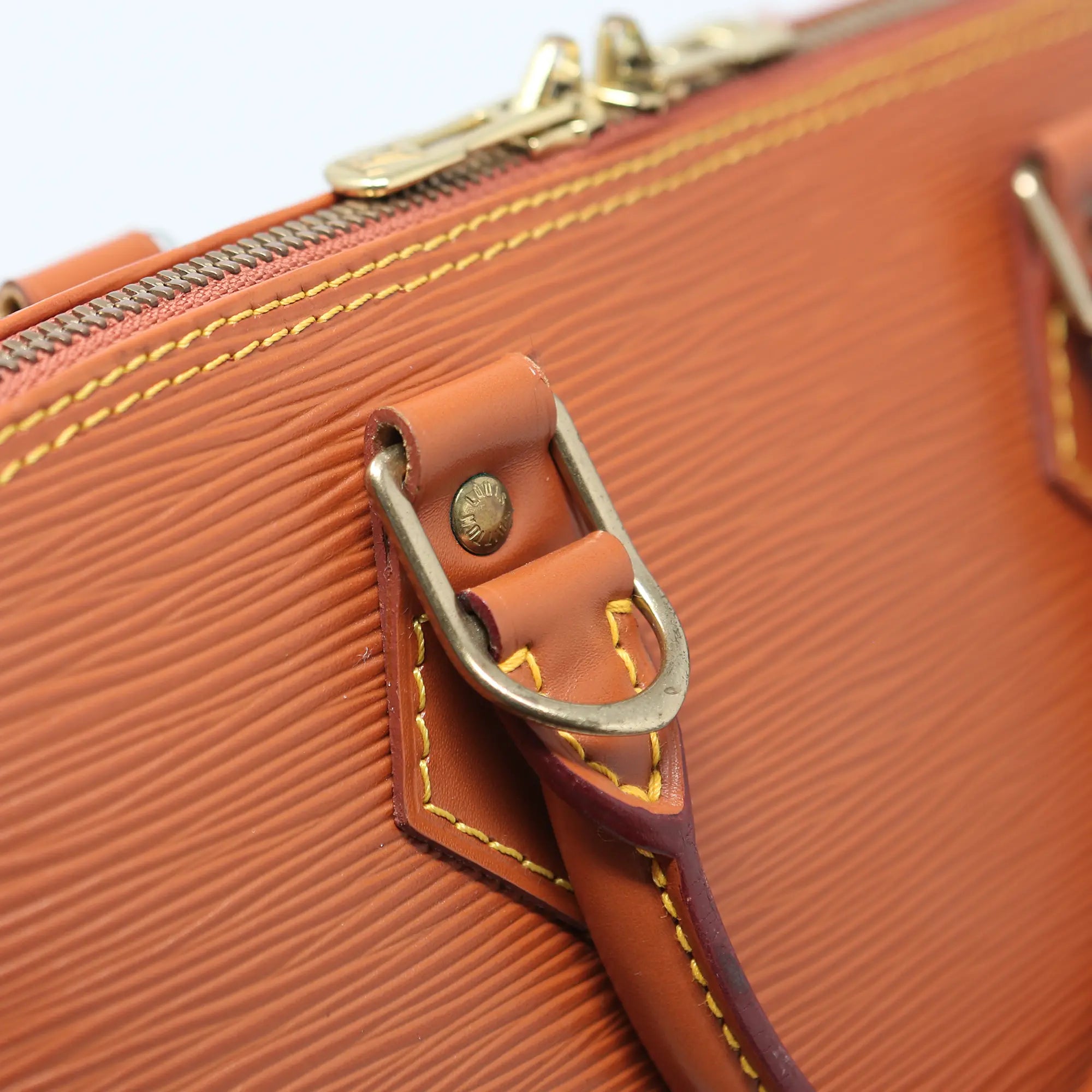 Borsa a mano Louis Vuitton Alma pelle EPI cognac