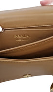 Borsa a mano Prada color beige e bordi oro
